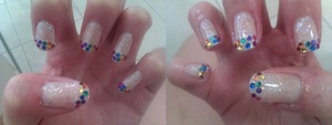 Glittery nails with rainbow gem tips