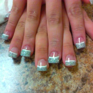 Free form acrylic nails with silver glitter tips and white line