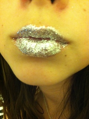 Sticky lip gloss then makeup glitter 