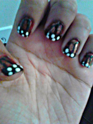 These are some monarch nails I did a while back. Sorry, this is a bit too complex to explain here, but there’s tutorials for it on Youtube. Just look up butterfly nails. The bronze color is fire amber by Nyx. The black and white are just some random nail art stripers I had.
