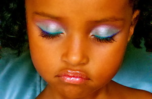 This is my daughter and she lets me practice on her...the greenish white color on her lid is from her kiddie palette called Fab 