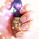 Gold Glitter on Taupe Nails
