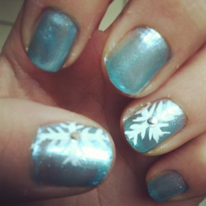 Snowflake nails with stick on accents. Painted myself.