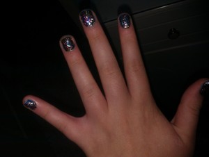 Base with a blue metallic nail polish ad sprinkle chunky glitter on top! 