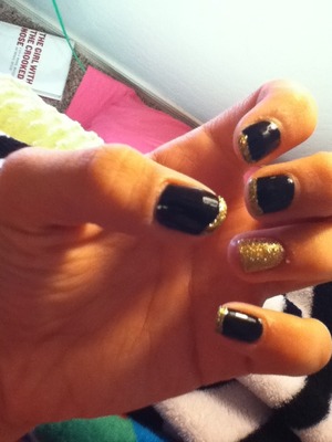 Black butter London nail polish with a sparkly ring finger and tips!