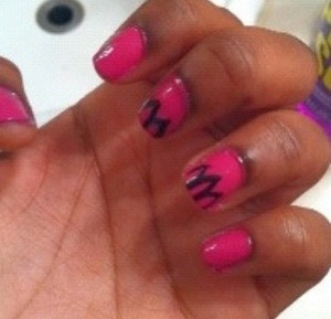 I just used a plain plain pink nail polish and used a black striper to do the petals and a clear top coat. 