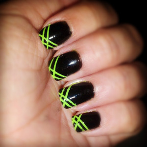 this cute style was made with black and green polish and striping tape