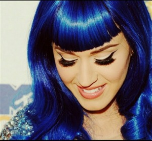 she is just beautiful,i love her make up and hair