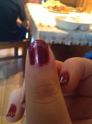 Burgundy nail polish with pink glitter polish. Excuse my fingernails and I can't paint my right hand very well :). 