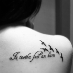 "Blood is thicker than water" In Gaelic Irish and 5 birds to represent each member of my family :) 
