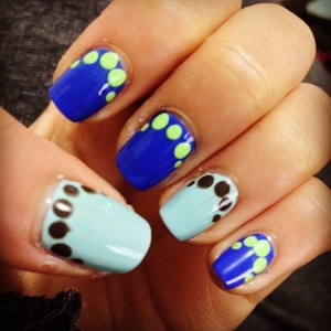 I wanted to spice up my blue mani so I added dots! I really like the way it turned out. :)