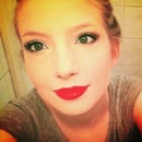 Red lip with a neutral eye and brown eyeshadow in crease, liquid eyeliner and soft kohl eyeliner 