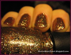 China Glaze's Christmas polish "Twinkle Lights" over a red Bourjois.
Read all about it on my blog: 
http://rainbowifyme.blogspot.com/2011/12/china-glaze-twinkle-lights.html