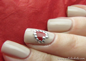I used Color Club Who Are You Wearing and Reddy Or Not polishes with some round studs for this look