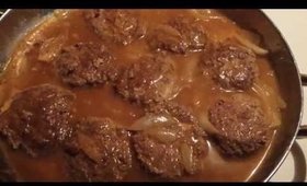 Hamburger patties with onions and gravy