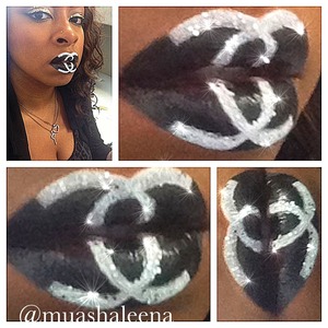 I used the black from the Make Up Forever 12 color Flash Palette on my lips. I then set it with black pigment from Inglot. Then I drew on the 'C's with the white from the flash palette. I then applied silver MAC glitter to the 'C's.