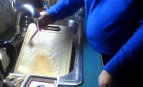 cleaning makeup brushes on a old cutting board with fine bumps on it