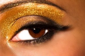 A play on the usual smokey eye with shimmery gold eyeshadow.