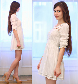 White dress, featuring scoop neck, sleeveless, dual-tone design, yellow flower-shaped hem. Someone goes with almost any kind of casual necklace. Mix with your favorite high heels.