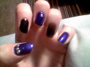 purple and black nails with decals.
The purple is Sinful colors ''Lets Talk".