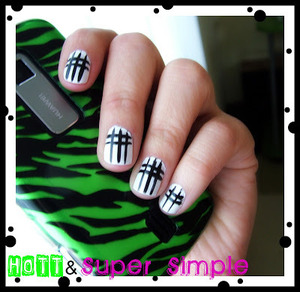 Check out the super simple tutorial at http://chelliglamvixen.blogspot.com/2011/04/super-easy-cool-nail-design.html