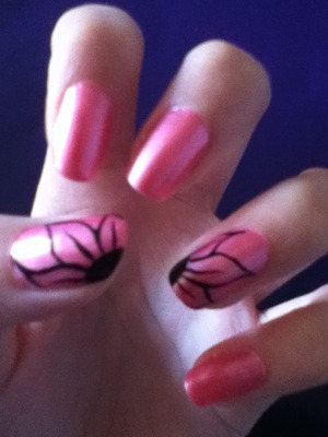 Pink nails with black flower out line on two nails