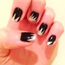 Silver spiked tipped black nails