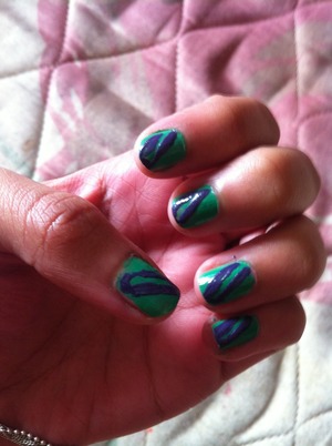 Green nails with purple stripes
