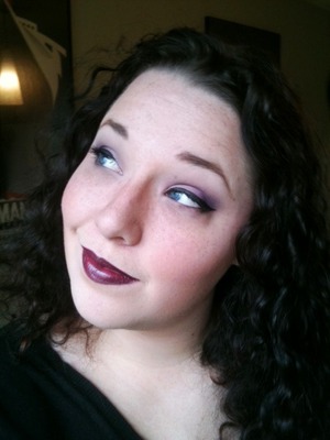 Subtle purple shadow and semi-thick winged eyeliner paired with a super dark plummy lip for fall.  Also rocking my natural curls down for once.