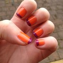 Juicy orange nail with a purple french tip