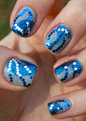 I use glitter all the time so to make my NYE nails extra-special I added glitter to the glitter!

http://www.dressedupnails.com/2013/01/my-new-years-eve-nails-wavy-blue-silver.html
