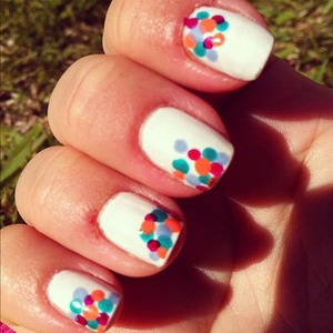 White background with multi color polka dots done with the tip of a bobby pin
