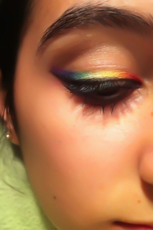 Makeup of rainbow: red, orange, yellow, 2 shades of green, blue and purple. 