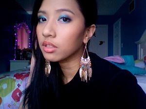 Bright blue eye and very muted coral lips! :) Lips appear like a peach on camera but it's a lot brighter IRL.