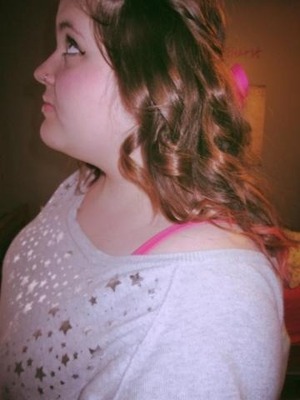 Messy curls using a flat iron and bows and whatnot :)