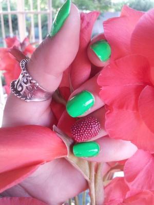 caviar nails are really in style right now, and the ring finger accent nail is too...and the neon green also seen in recent fashion