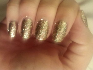Twinkle Lights by China Glaze.  Gold, green and red sparkles.