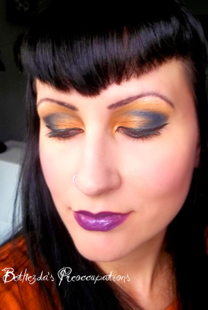 This is a Halloween inspired black and orange eye look using indie cosmetics from Mazzy Cosmetics (eyes) and Detrivore cosmetics (cheeks and lips). 