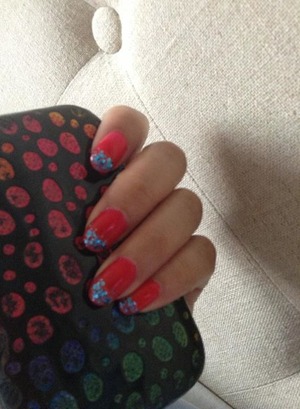 red with a clear and blue glitter polish.