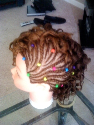 Teenage Hairstyle: Braids with colorful beads with curls on the side