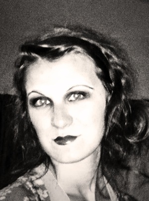 I did this in black and white cause it looks so authentic! I love it! My eyeshadow was brown and black and my lips were a red-burgundy color (a mix of bright red and blackberry lipstick).