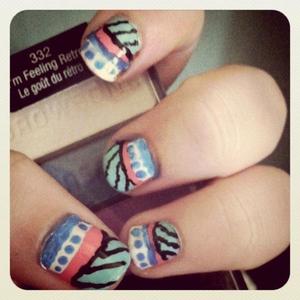 This was my first try at tribal nail art and it is a bit messy. I have a tutorial for this on my blog http://superbeautyrush.blogspot.com if your interested!