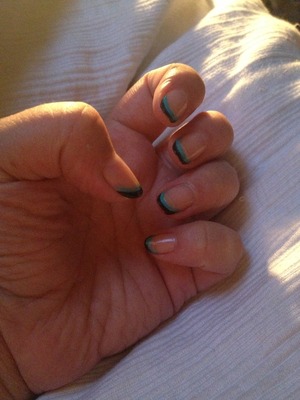 Naked nail with black and blue tips.