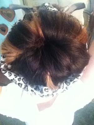 Pin curled hair in a bun with my cheetah bandana. 