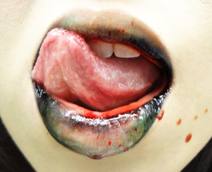 This was a conceptual lip that was inspired by one of my doodles. Blanked out my lips with concealer and used black, brown, and green eyeshadows to create a gradient out from the edges. Then topped it all with a THICK layer of clear gloss, and a spattering of fake blood. 