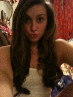 Goofy face... But here is my hair curled with a straightener! Pretty good for my first attempt.