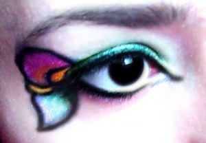 This was my first attempt of actually doing make up "art", apart from pride and tri-colour flags.  Unfortunately, while I like this, it was during this art I realized I had such deepset eyes, which would mean more designs would be even more difficult ):