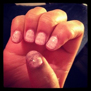 Pick a light base color then dip the piece of newspaper in acetone and press onto nails! Add a top coat and you're done! 