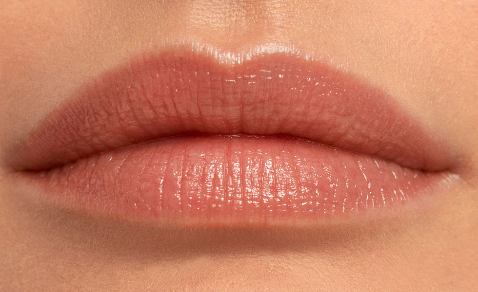 Model wearing Chantecaille Lip Sheer in Swallowtail