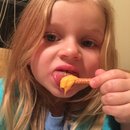 Kyleigh eating cheese and pretzels 